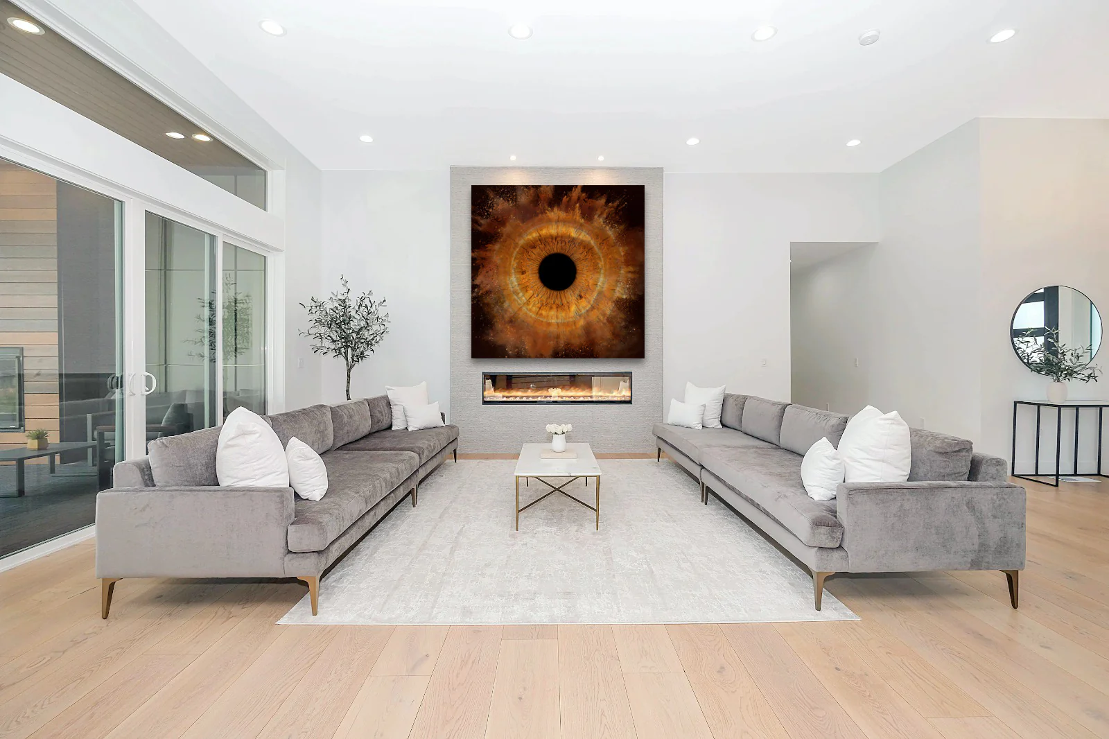 Art gallery style living space - white walls, multiple framed eye art pieces, modern furniture